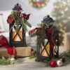 Set Of 2 Battery Operated Lighted Christmas Metal Holiday Lanterns With Floral Accents And Timer 1 Set Of 2 Battery Operated Lighted Christmas Metal Holiday Lanterns With Floral Accents And Timer -Home Candle Shop 2491810 main image
